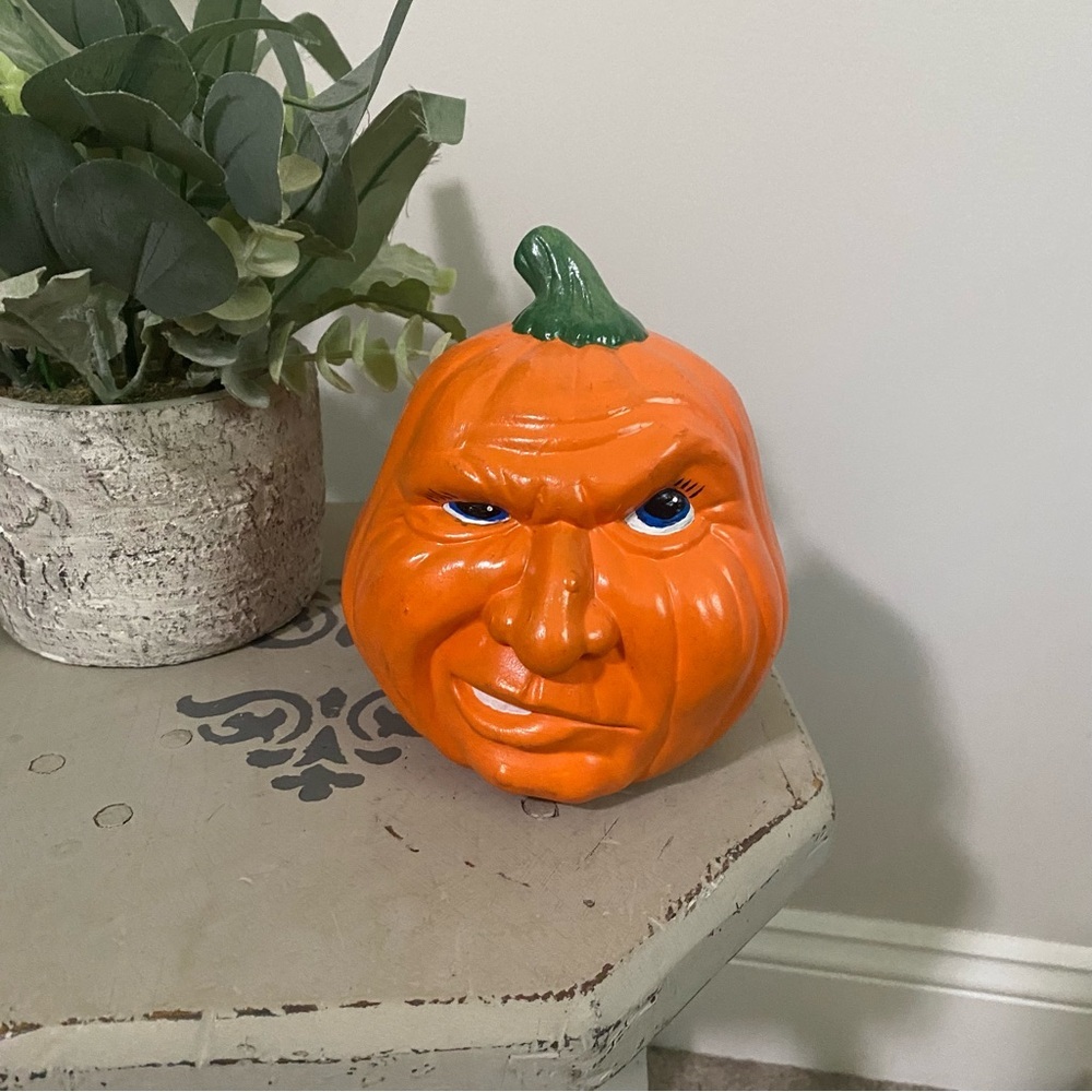 Vintage Ceramic Pumpkin Face Figurine in Bright Orange with Green Stem